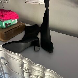 Black high heel boots…never worn.  Still in box..they didn’t fit me.